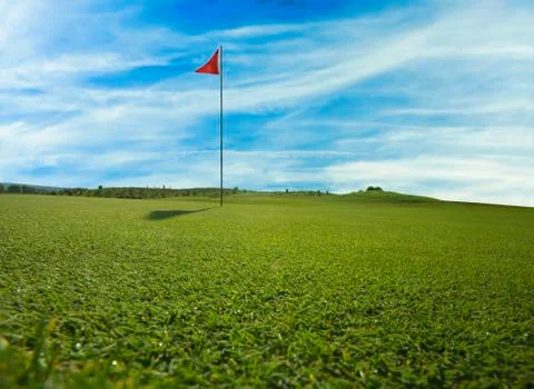 Golf course with red flag Stock Photos