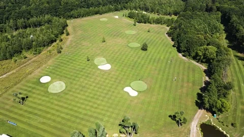 Golf course with several players during the game Stock Footage 239066612
