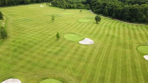 Golf course with several players during the game Stock Footage 239066630