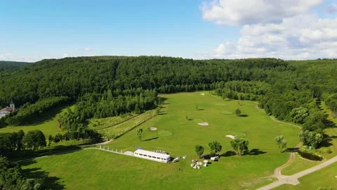 Golf course with several players during the game Stock Footage 239066653