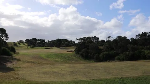 Golf course on a sunny day practice range driving range Stock Footage 228408164