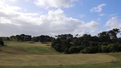 Golf course on a sunny day practice range driving range Stock Footage 228408176