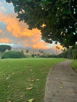 Golf Course at Sunset with Tropical Clouds Stock Photos