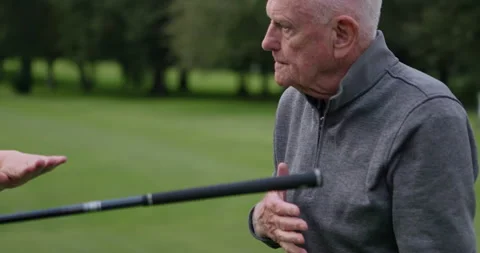 Golf course, trainer teaching man and club at field, nature and outdoor for help Stock Footage 335885259