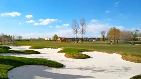 The golf course under the blue sky &amp; white clouds Stock Photos