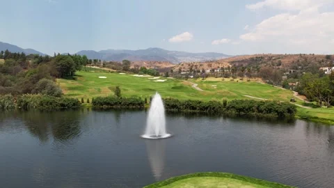 Golf course view with pond (Drone Aerial) Stock Footage 248174729