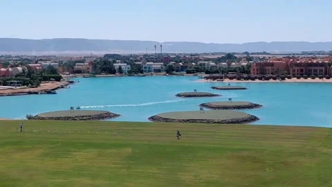Golf driving range with lagoon islands and resort in El Gouna Egypt. Stock Footage 340106322