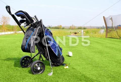 Golf field with blue golf bag.JPG Stock Photos