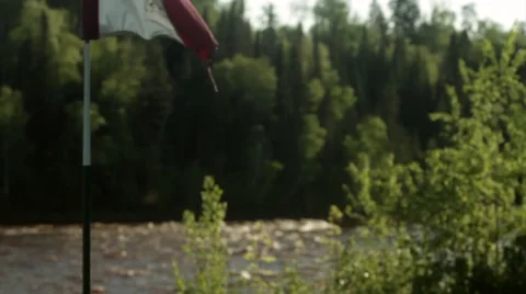 Golf flag and river stream in background Stock Footage 40751726