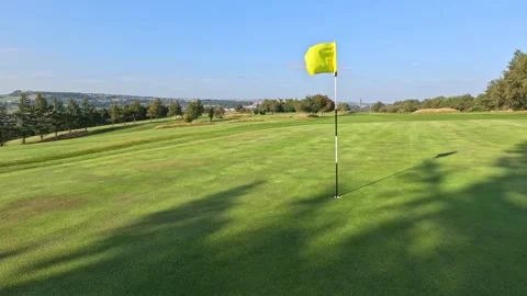 Golf flag blowing in wind Stock Footage 283399758