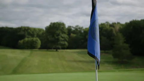 Golf flag flying in the wind slow motion 스톡 동영상 153699665