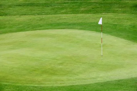 Golf flag on the green grass Stock Photos
