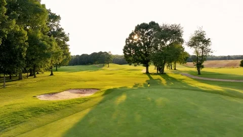 Golf Green with Sunset in Background Stock Footage 320313252