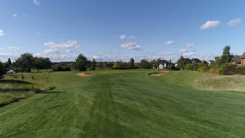 Golf Hole Fly Up To Green Using a Drone On A Sunny Day UK Stock Footage 92856856