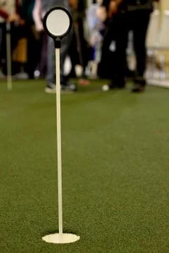 Golf hole for targeting with a part to write a message Stock Photos