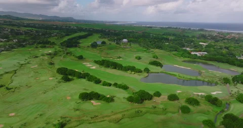 Golf hotel coast Indian ocean. Golf course and villas on the beach. Aerial view Видео 200025543