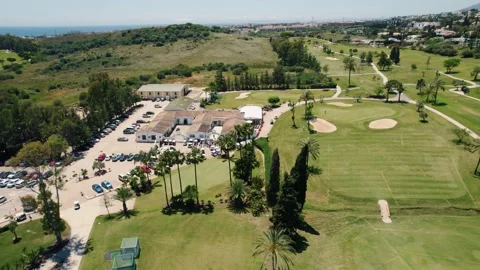 GOLF MARBELLA drone aerial viewlooking back watching the sea 스톡 동영상 233141953