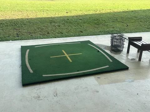 Golf pad at golf driving range Stock Photos