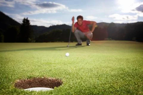 Golf player analyzing green. Stock Photos