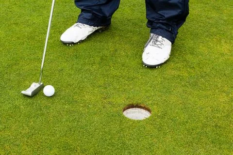Golf player hitting the ball Stock Photos