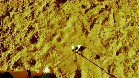 Golf player hitting the ball in the sand, slowed down Stock Footage 77863536