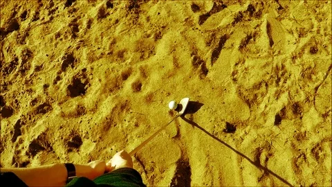 Golf player hitting the ball in the sand Stock Footage 77863552