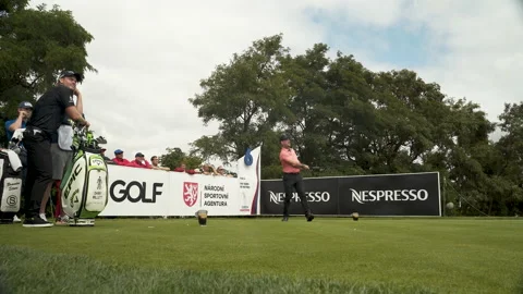 Golf player hitting the ball with a swinging shot at a tournament. Stock Footage 169372666