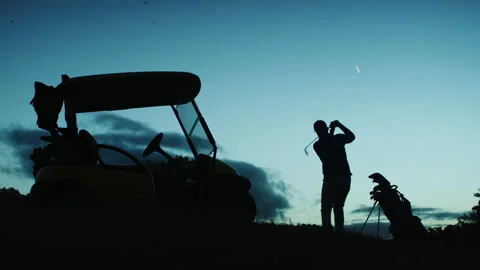 Golf Player hitting the Golf Ball at twilight Stock-Footage 264152583