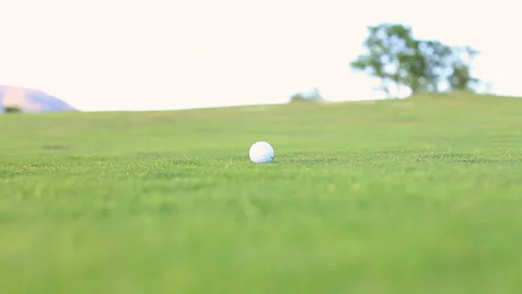 Golf player kicking the ball at the golf course Stock Footage 232922308