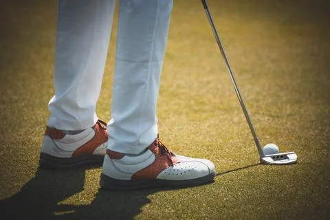 Golf player with mace ready to launch the ball Stock Photos