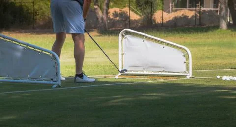 Golf player making a swing with a golf  fairway wood course Stock Photos