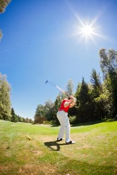 Golf player performs a swing Stock Photos