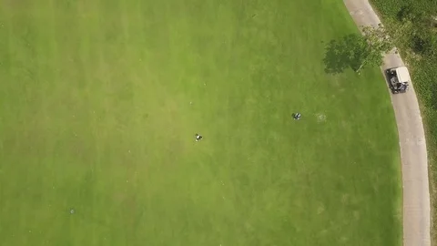 Golf player playing on green course top view from flying drone. Aerial view Video stock 107139040