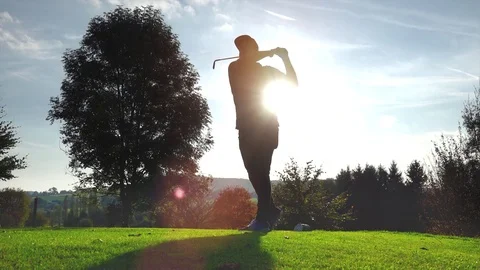 Golf Player plays golf on a beautiful summer morning Stock Footage 81241567