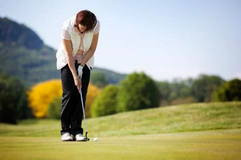 Golf player putting ball. Stock Photos