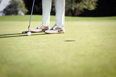 Golf player putting with copyspace. Stock Photos