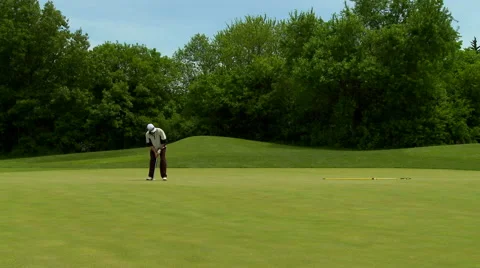 Golf player on putting green Stock Footage 50558610