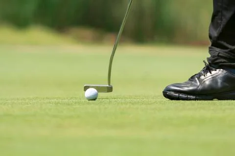 Golf player putting on the green Foto stock