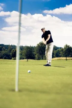 Golf Player Putting Photos
