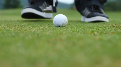 Golf player strikes ball on golf course Stock Footage 63828953