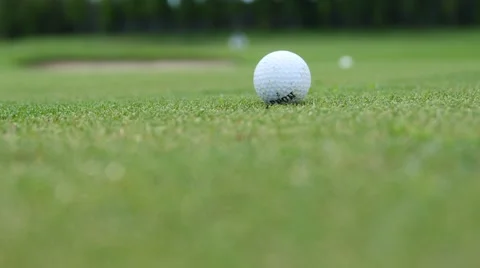 Golf player strikes ball on golf course Stock Footage 63829436