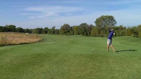 Golf player tee swing Stock Footage 74765046