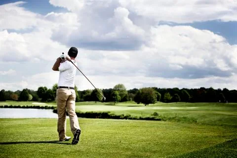 Golf player teeing off Stock Photos