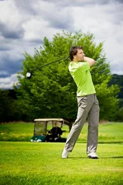 Golf player teeing off Stock Photos