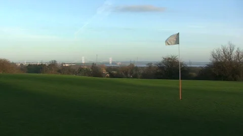 Golf Pole Flag Flapping in the Wind with Ball Stock Footage 264533