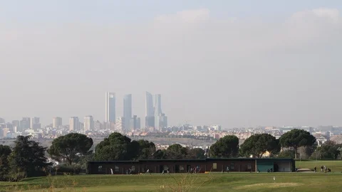Golf practice course with the Madrid skyline in the background Stock Footage 124331482