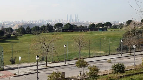 Golf practice course timelapse with the Madrid skyline in the background Stock Footage 124331061