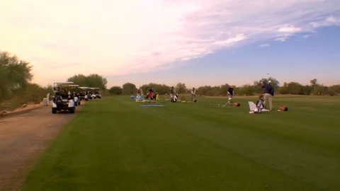 Golf practice range golfers busy  Stock Footage 125278012