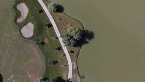 Golf resort, aerial. Path, lake and golf courses. Luxury relaxation Vídeos de archivo 171565897