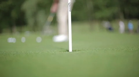 Golf sink - Golf Player aims for hole. Stock Footage 44125353